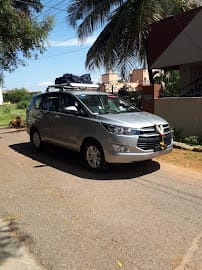 Bookurcab-Cabs & Taxi in Mysore - Outstation Cabs in Mysore Tempo Traveller Rent Mysore business photograph