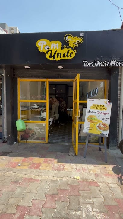 Tom uncle momo business photograph