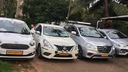 Manipal taxi & Udupi taxi - East West Travels Manipal business photograph