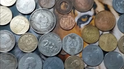 I am dealing old coins and note business photograph