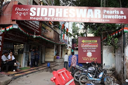 Siddheshwar Jewellers & Pearls - Best Necklace & Earrings Gemstone Jewellery Set in Charminar Hyderabad business photograph