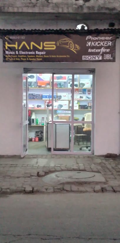 Hans music and electronics repair business photograph