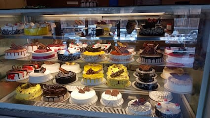 7th heaven cake shop Hubli- (Pure Veg ) Slice of Happiness business photograph