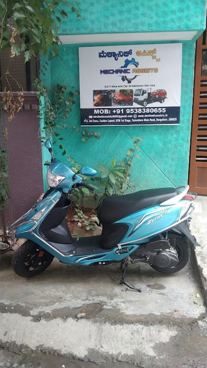 Mechanic Assists business photograph