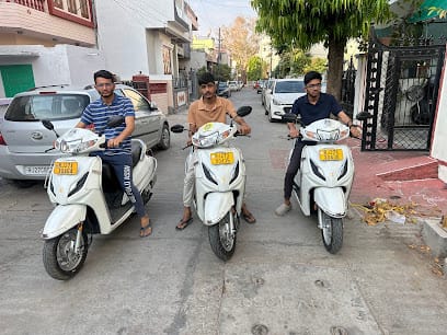 The take and ride ( Bike on rent in Udaipur ) bike rental, activa on rent, bike on rent business photograph