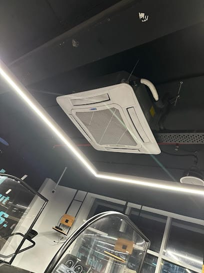 Old AC, fridge, washing machine business photograph