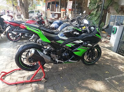 SHRI GURU AUTOMOBILES - Best bike service - superbike service point & Battery Shop business photograph