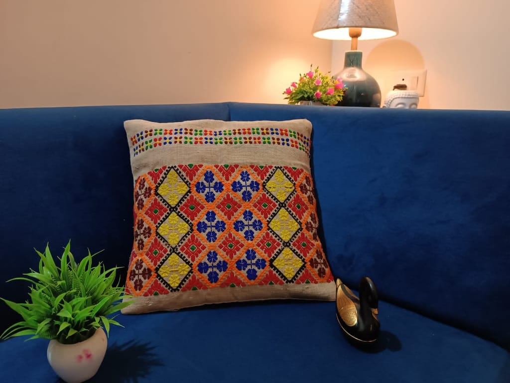 Embroidered cushion cover with intricate floral design, handmade with cotton fabric, perfect for adding a touch of elegance to your home decor