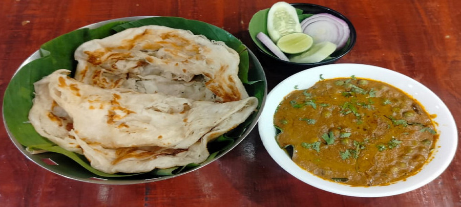 Kerala parotta with green piece curry and salad combo
