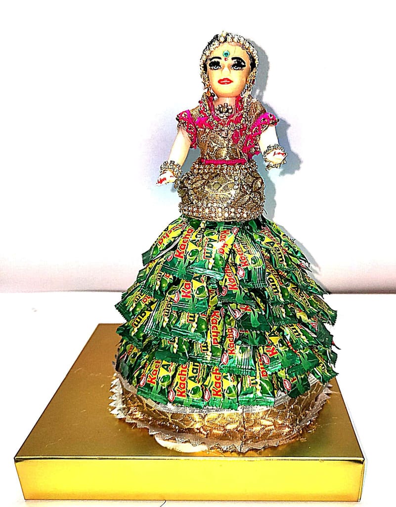 Bridal doll wearing a Pan Pasand candy wrapper dress view 2