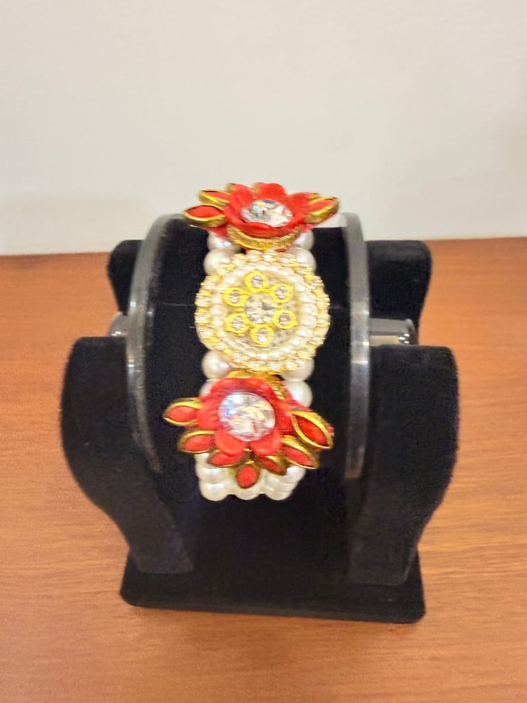 vibrant red floral moti pearl bracelet centered with shiny crystal stones