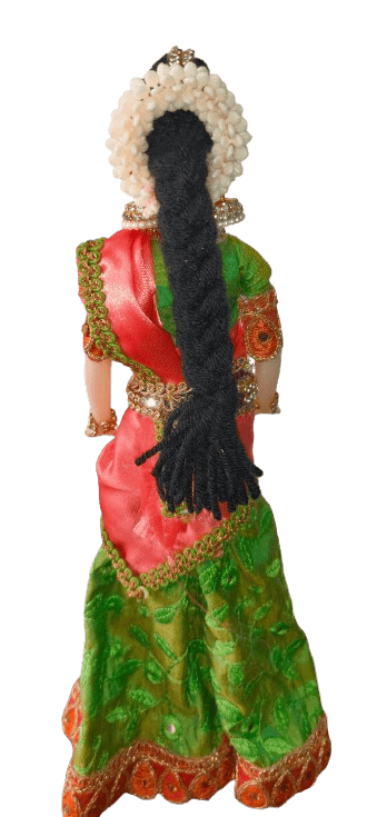 Traditional Indian decorative half saree doll in green and orange view 2