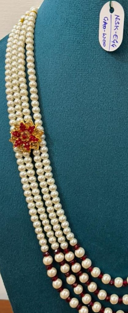 groom multi-strand white moti necklace featuring maroon pearl spacers and flower charm view 2