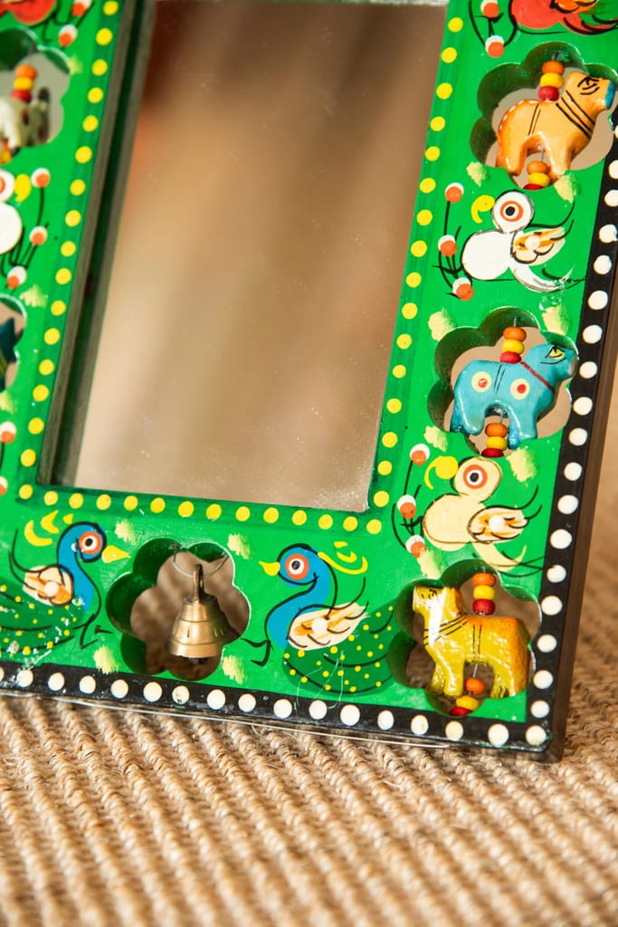 Handcrafted Wooden Mirror Frame with Intricate Animal and Bell Design view 2
