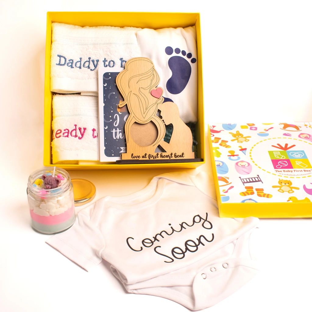 The Baby First Box Baby Shower Gift Hamper for Mom to Be -XXL Tshirt for Mom, Hand Towel for Mom & Dad, Baby Theme Candle, Love at First Sight Frame, Baby Romper(0-3 Months) in a Gift Box