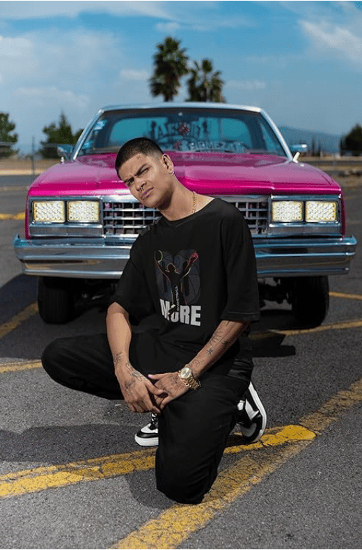 Black T-shirt with a graphic of a basketball player and the word "MORE"
