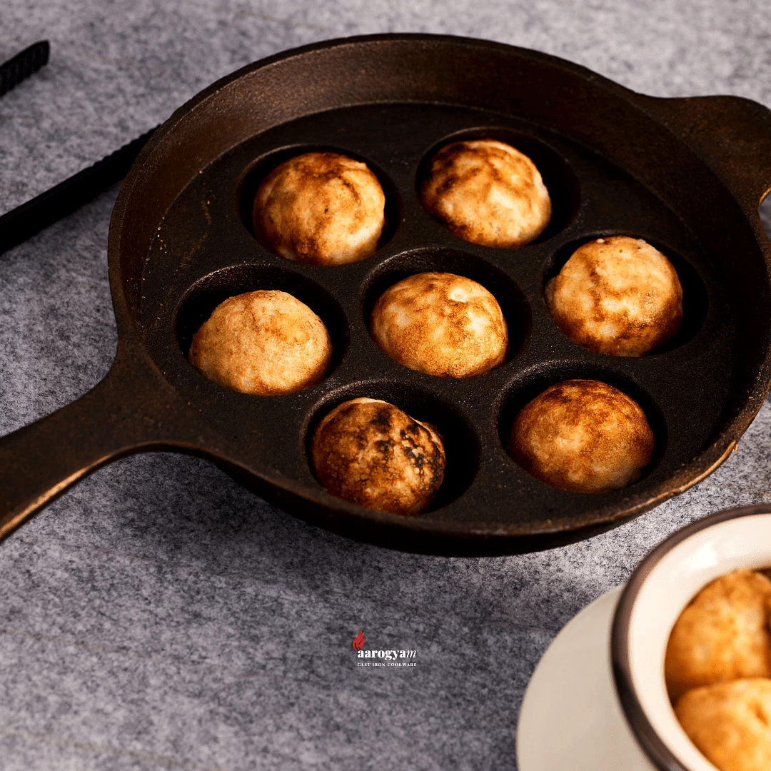 Aarogyam Cast Iron Paniyaram Pan 7 Cavity , Handle with Ring at Bottom for support, Pre-Seasoned 7.5 inch Diameter (19 cm), Naturally Non-stick, Toxin-Free, Gas & Induction Compatible, Weight- 1.9 kg (Colour - Black) by Aarogyam - The Cast Iron Shop view 2