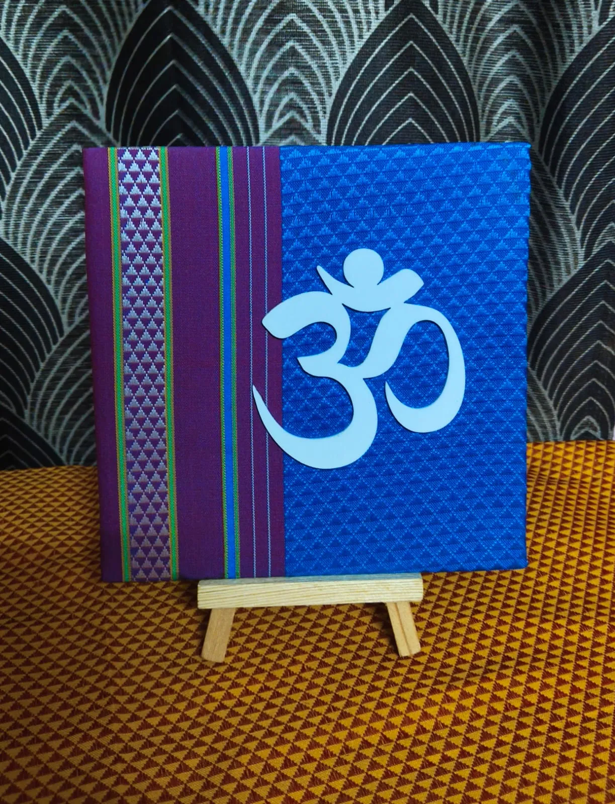 Om hand crafted with stand. view 2