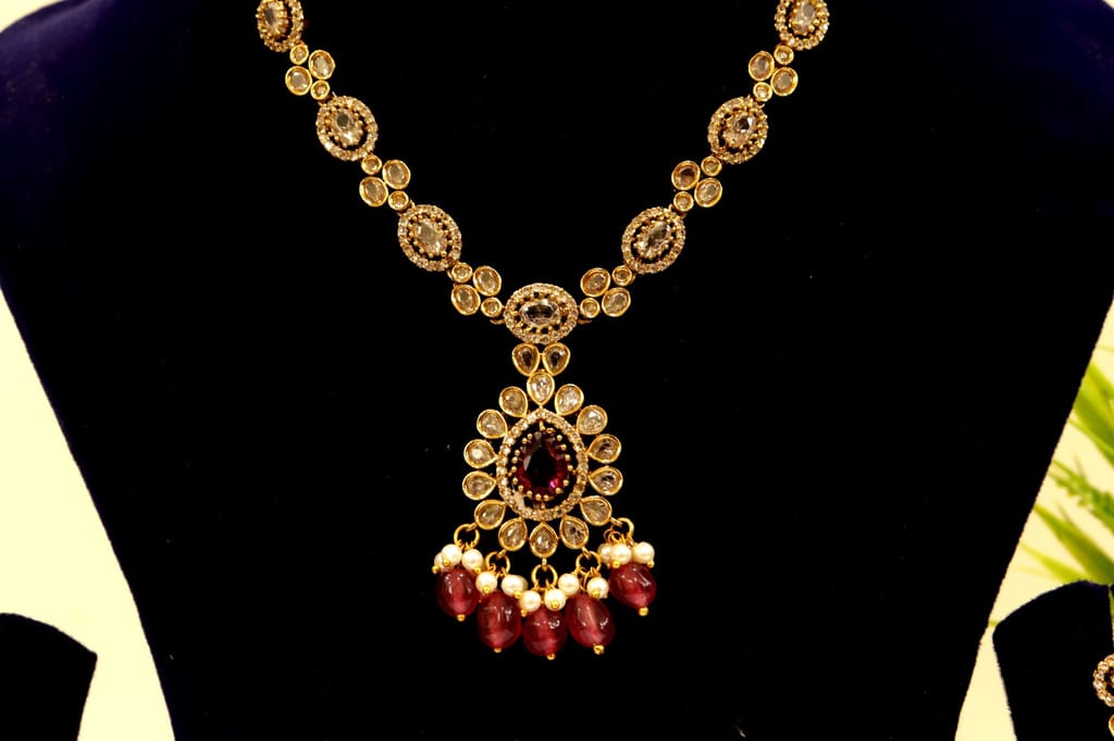 Gold Plated Kundan Necklace Set With Maroon Stones view 2