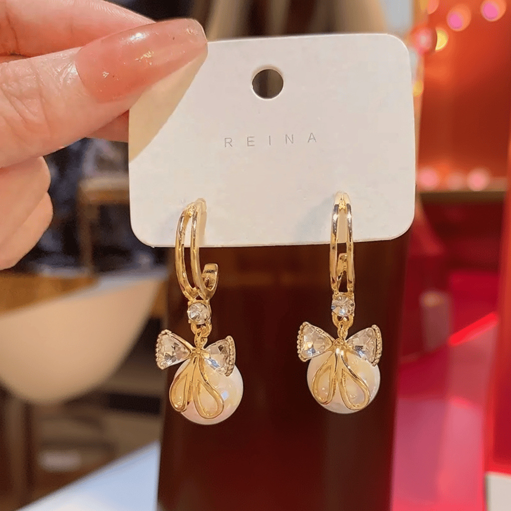 Elegant Gold Tone Hoop Dangle Earrings with Crystal Bow & Iridescent Pearl Drop