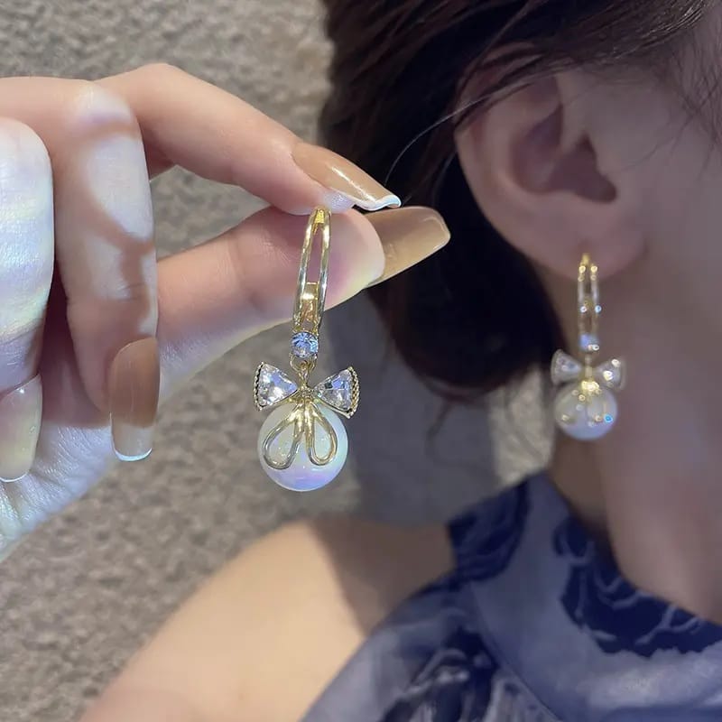 Elegant Gold Tone Hoop Dangle Earrings with Crystal Bow & Iridescent Pearl Drop view 2