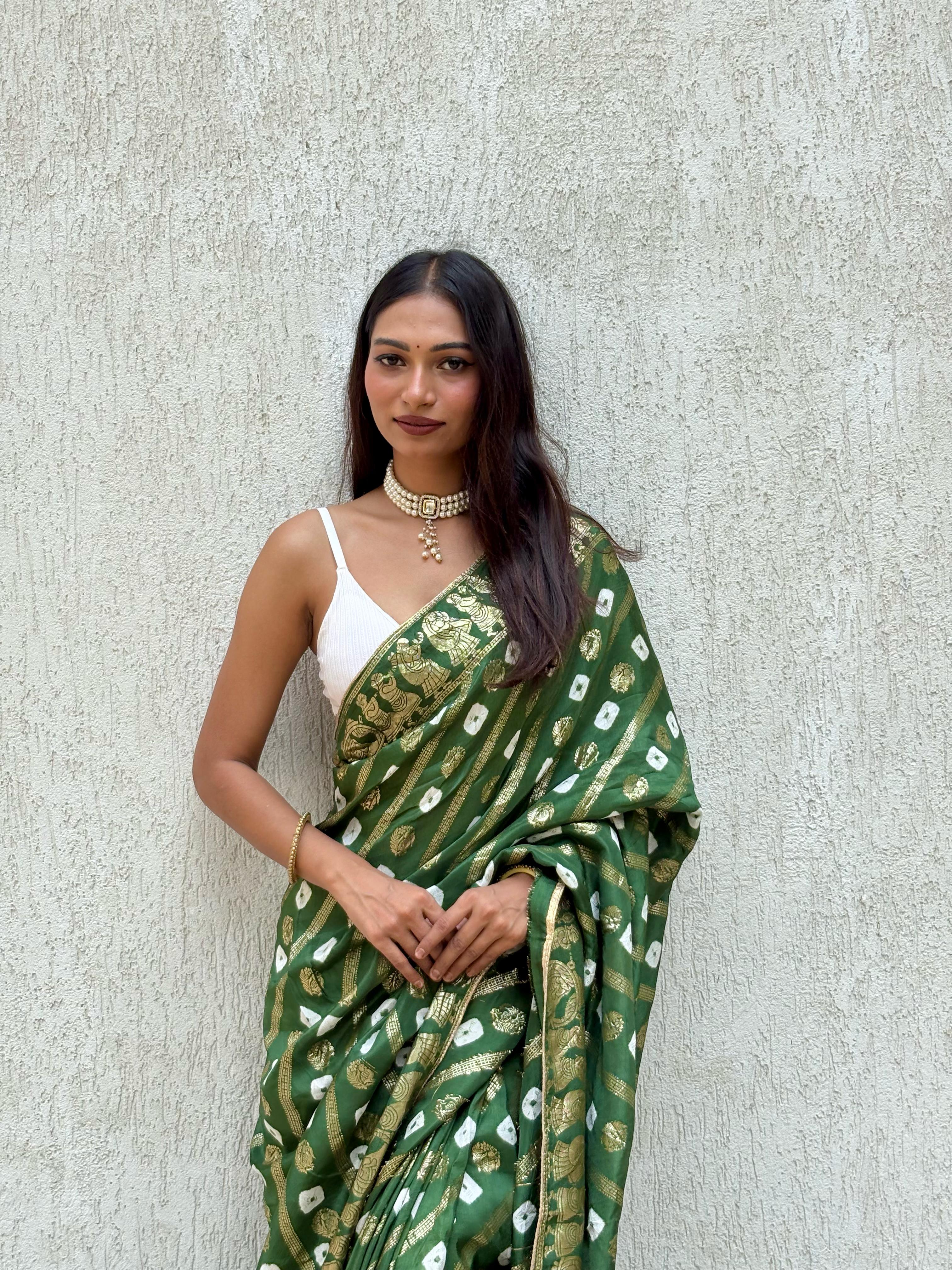 Pure dola silk fabric with beautiful dol zari zari all over and hand bandej zari havvy contrast bp suppr Saree view 2