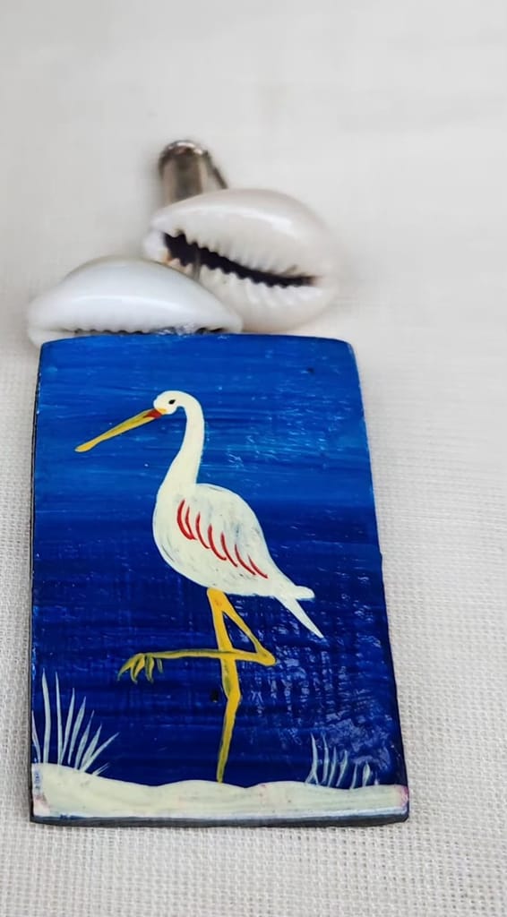 Hand painted wooden earrings featuring a blue heron design, made with sustainable materials. view 2