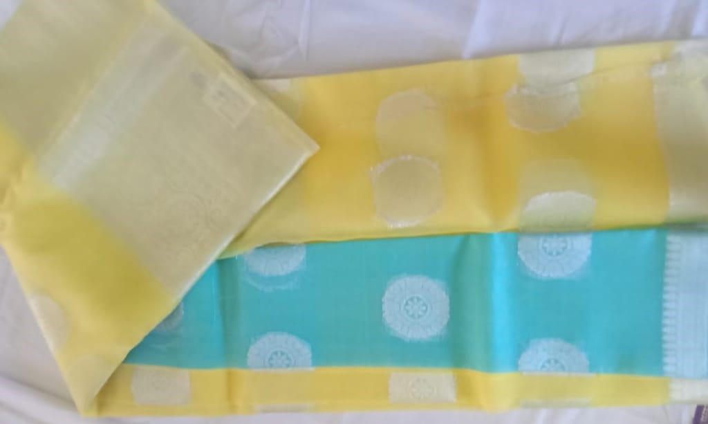 Light Yellow And Light Blue Color Tissue Silk Saree With Silver Zari Weaving Work
