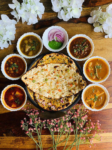 Paneer butter naan thali