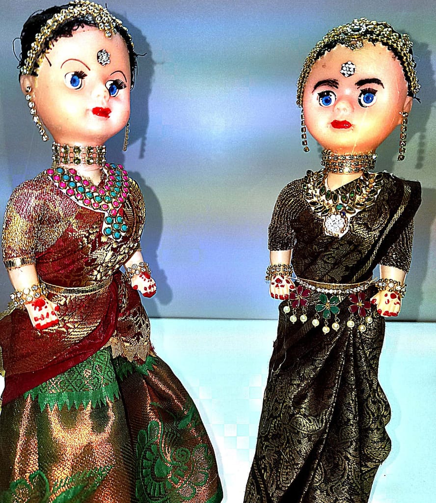 Indian Traditional Dolls in Colorful Attires**Meta Description:** These Indian traditional dolls are dressed in colorful and intricate outfits, making them perfect for display or as a gift. view 2