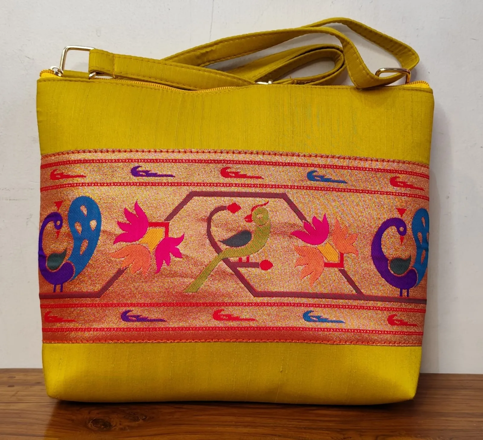 Flaunt this festive season with our elegant Paithani Sling Bag