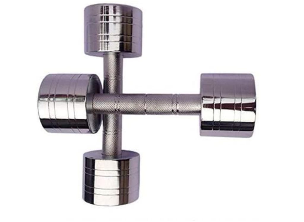 A pair of chrome dumbbells on a white background