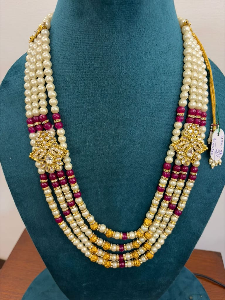 4 Strand pearl multi layer necklace featuring gold kundan side brooches and maroon beads