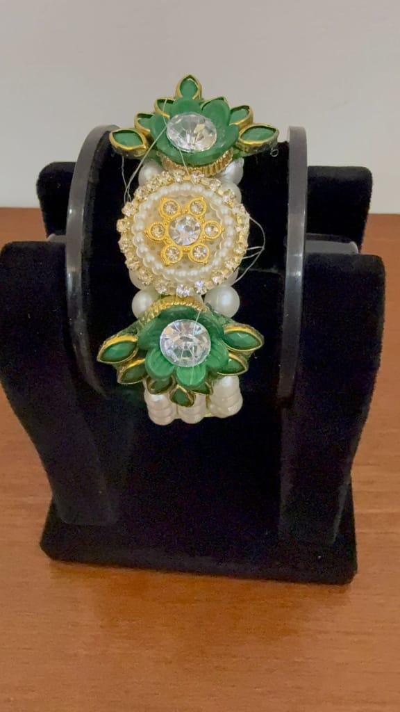 An Elegant Green And Golden Lotus-themed Moti Pearl Bracelet Centered With Sparkling Crystals